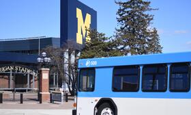 photo of a TheRide bus in front of U of M Stadium