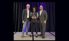 Lilliane Webb (middle) accepted the award on behalf of TheRide/getDowntown program. She is pictured with: Thom Cerny, ACT Treasurer (left) and David Stauss, ACT Executive Director (right)